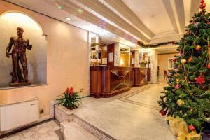 a christmas tree in the lobby of a hotel at Hotel San Remo in Rome
