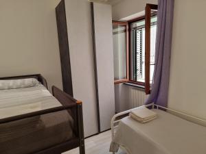 Postel nebo postele na pokoji v ubytování Rosy Vacation Home