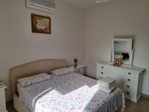 Postel nebo postele na pokoji v ubytování Rosy Vacation Home