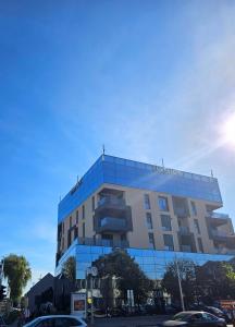 a building with a lot of windows on it at Apartman PETRUS close to OPUS ARENA and center in Osijek