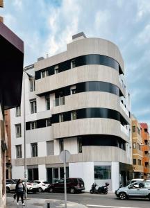 a building with cars parked in front of it at Royal Suites in Las Palmas de Gran Canaria