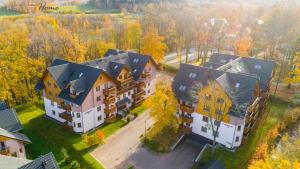 an aerial view of a large house at Wonder Home - Apartament Grey w spokojnej okolicy - blisko terenów zielonych in Karpacz +11 photos