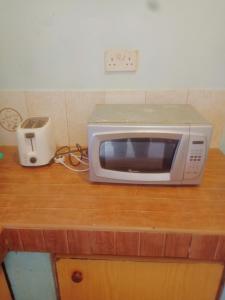 Η κουζίνα ή μικρή κουζίνα στο Bluemoon Apartment +2 φωτογραφίες