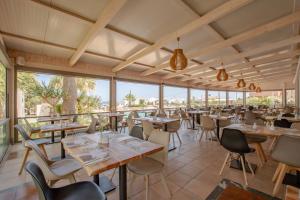 A restaurant or other place to eat at Gouves Bay by Omilos Hotels