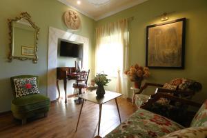 a living room with a couch and a table at Villa Ginori 1755 in Londa