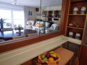 a living room with a bowl of fruit on a table at SEAFRONT VIEW-Nice Appartment in Downtown Blanes in Blanes