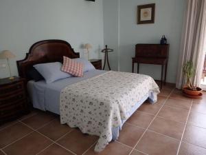 a bedroom with a bed with a blanket on it at SEAFRONT VIEW-Nice Appartment in Downtown Blanes in Blanes