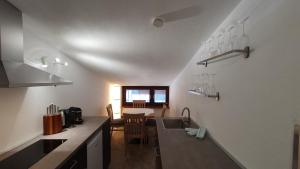 a kitchen with a sink and a counter top at Absolute Active Roulette Apartments Kirchberg in Kirchberg in Tirol +56 photos