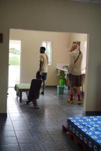 a group of people standing in a room at Dafa Tanga Lodge in Sanyang