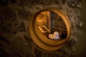 a close up of a mirror with a stuffed animal at Pri Štefacovih - Authentic house in Grahovo