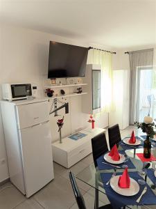 a living room with a table with red cones on it at Apartment Mario, Novalja in Novalja