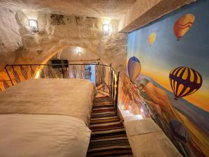 A bed or beds in a room at Atilla's Cave Hotel