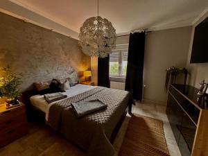 Posteľ alebo postele v izbe v ubytovaní Apartman Pannonica Pin 0-24h