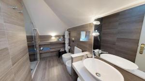 a bathroom with a sink and a toilet at Hotel Metropole in Santa Margherita Ligure