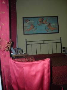 A bed or beds in a room at Hotel Agli Artisti