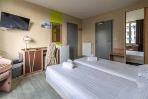 Postel nebo postele na pokoji v ubytování Sleep & Go Blankenberge