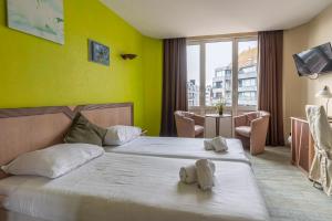 Postel nebo postele na pokoji v ubytování Sleep & Go Blankenberge