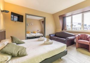 Postel nebo postele na pokoji v ubytování Sleep & Go Blankenberge