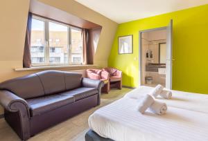 Postel nebo postele na pokoji v ubytování Sleep & Go Blankenberge