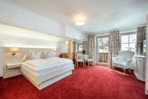 Posteľ alebo postele v izbe v ubytovaní Hotel Tauernblick