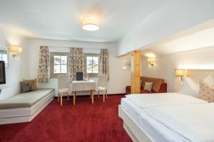Posteľ alebo postele v izbe v ubytovaní Hotel Tauernblick