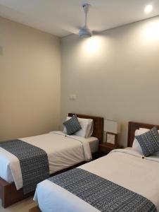 Kutus Bali Guesthouse客房内的一张或多张床位