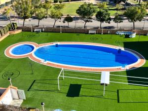 Bazén v ubytování ACV - Torremar-2ª linea planta 1 Norte 3H nebo v jeho okolí