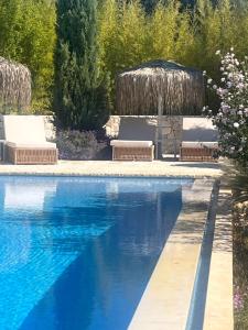 a swimming pool with a fountain in a yard at Shangri-La in Meganisi +23 photos