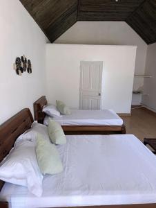Ένα ή περισσότερα κρεβάτια σε δωμάτιο στο Ambositra Lodge