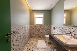 a bathroom with a sink and a toilet at Sheikh Zayed New Giza Near GEM & MOA in Abū Rawwāsh +13 photos