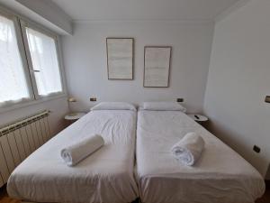 Postel nebo postele na pokoji v ubytování Pensión Aussie II