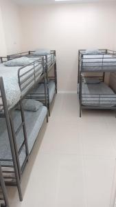 Łóżko lub łóżka w pokoju w obiekcie Hostel Las Rosas
