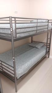 Łóżko lub łóżka w pokoju w obiekcie Hostel Las Rosas