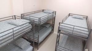 Łóżko lub łóżka w pokoju w obiekcie Hostel Las Rosas