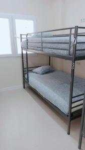 Łóżko lub łóżka w pokoju w obiekcie Hostel Las Rosas