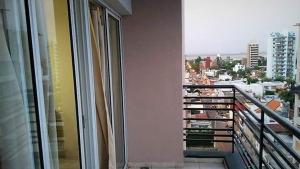 an apartment balcony with a view of a city at Nuez de la Isla "Centro Apart"-MICROCENTRO- Balcón al frente 8vo in Paraná +40 photos