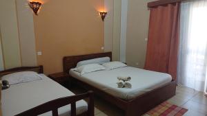 Postel nebo postele na pokoji v ubytování Central Hôtel