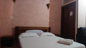 Postel nebo postele na pokoji v ubytování Central Hôtel