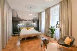 Posteľ alebo postele v izbe v ubytovaní U Kapra Apartments