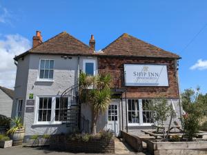 a building with a sign that reads skip my pharmacy at The Ship Inn in Dymchurch