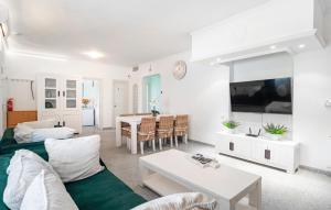 a living room with a couch and a table at 2 Bedroom Lovely Home In Carratraca in Carratraca