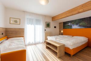 Postel nebo postele na pokoji v ubytování Villa Gemmy