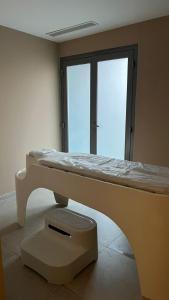 Postel nebo postele na pokoji v ubytování BUSINESS HOTEL SFAX