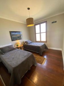 Postel nebo postele na pokoji v ubytování Sitio São Camilo