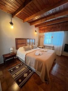 Ένα ή περισσότερα κρεβάτια σε δωμάτιο στο Raíces Hostería Boutique +31 φωτογραφίες