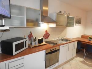 Kuchyň nebo kuchyňský kout v ubytování Appartamenti Franci