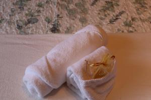 a towel sitting on top of a bed at Combarro Port in Combarro +68 photos