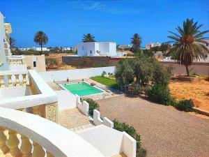 an aerial view of a house with a swimming pool at Résidence SUN SHINE DJERBA in Midoun