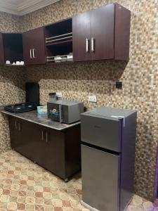 Kuchyň nebo kuchyňský kout v ubytování Blossom Apartment