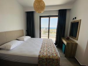 Postel nebo postele na pokoji v ubytování Anemoni Apartments